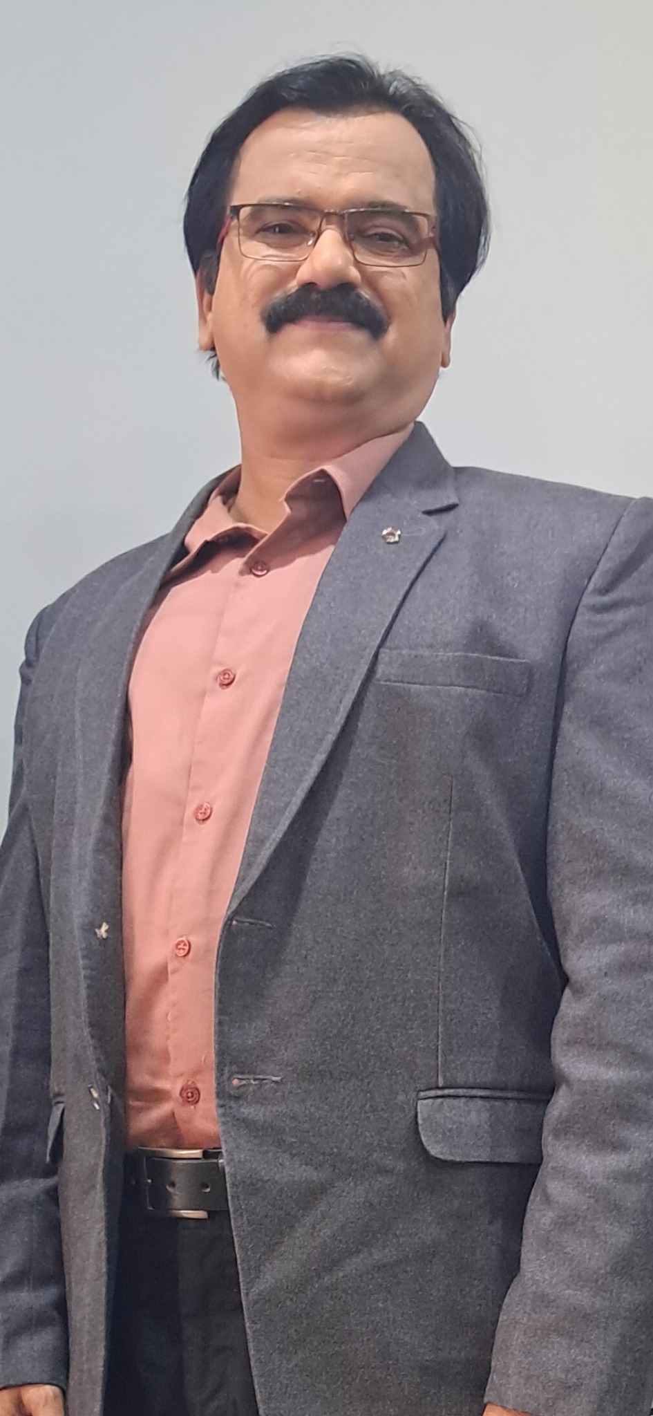 Actor Ramesh Donthula formal suit portrait